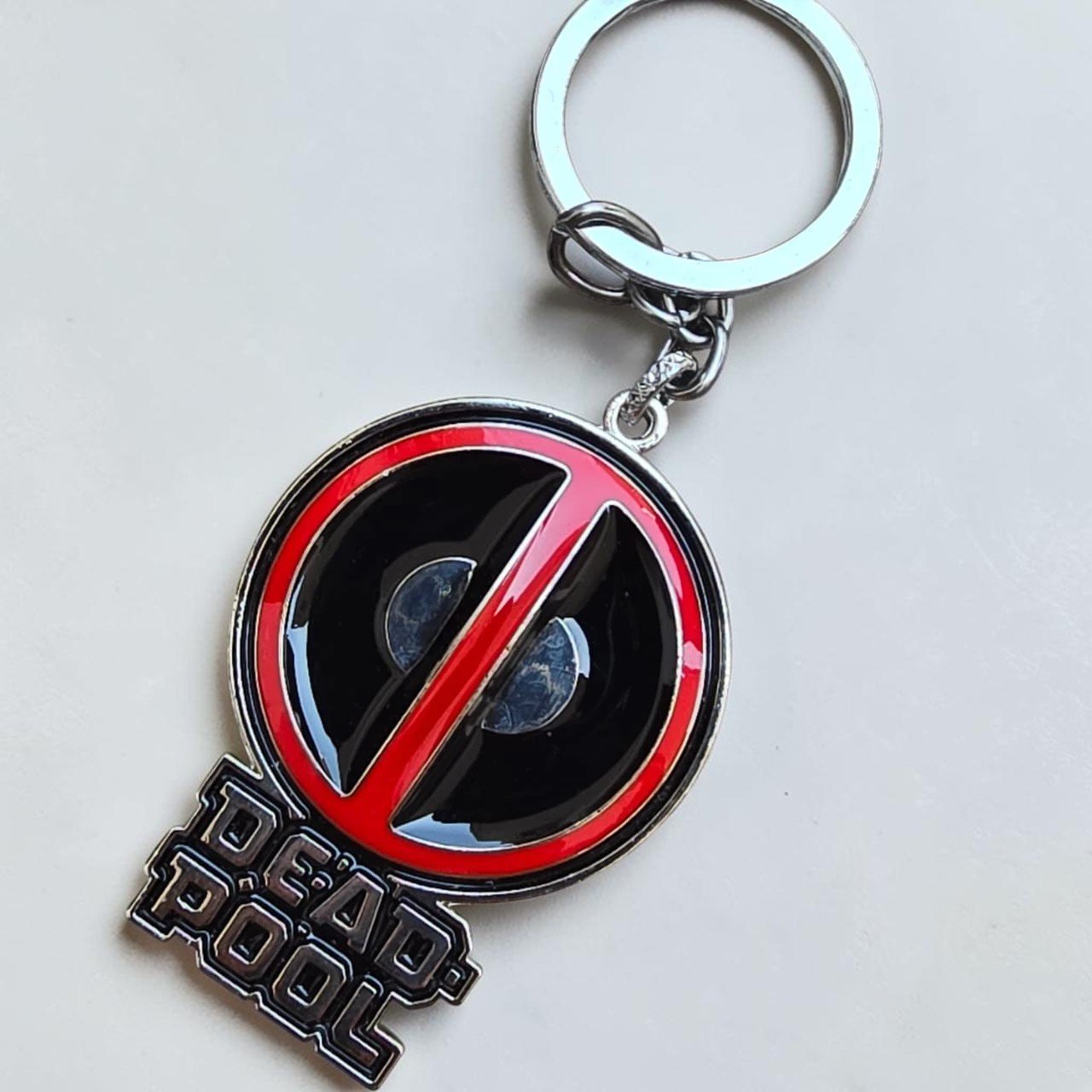 Deadpool Metal Keychain, Marvel Deadpool Keychain, Deadpool Logo Keychain, Metal Superhero Keychain, Red White Black Deadpool Keychain, Premium Deadpool Keychain, Marvel Collectible Keychain, Bike Keychain, Deadpool Mask Keychain, High Edition Paint Finish Keychain, Keychain.co.in, Marvel Fan Gift, Deadpool Merchandise, Comic Character Keychain, Metal Keychain for Bags and Keys